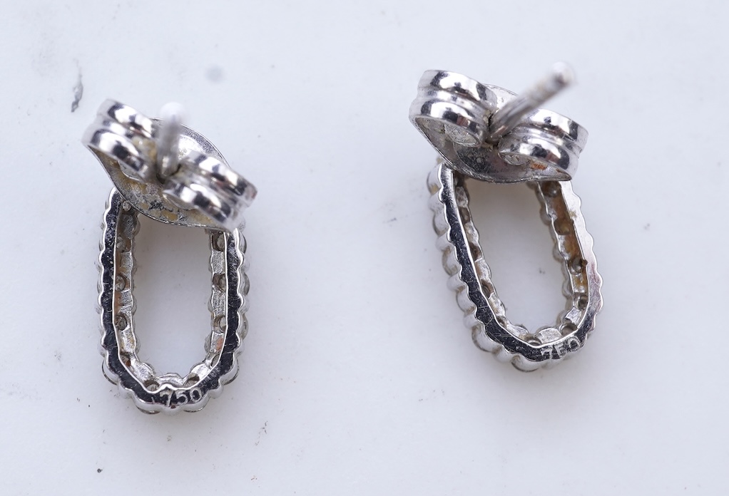 A diamond pendant and pair of diamond stud earrings